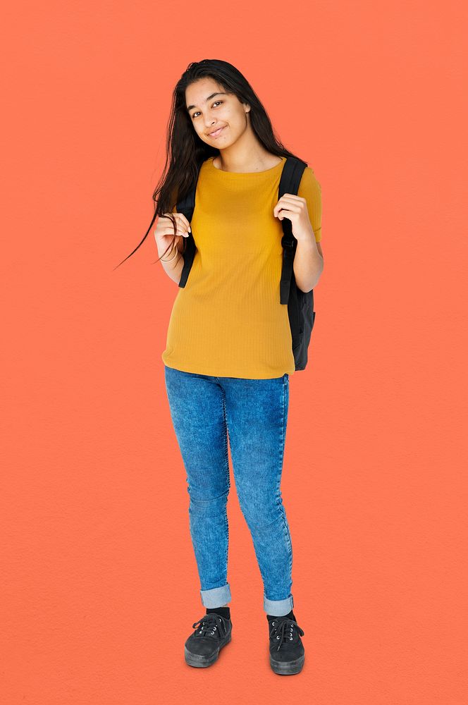 Young adult girl smiling and carrying bag