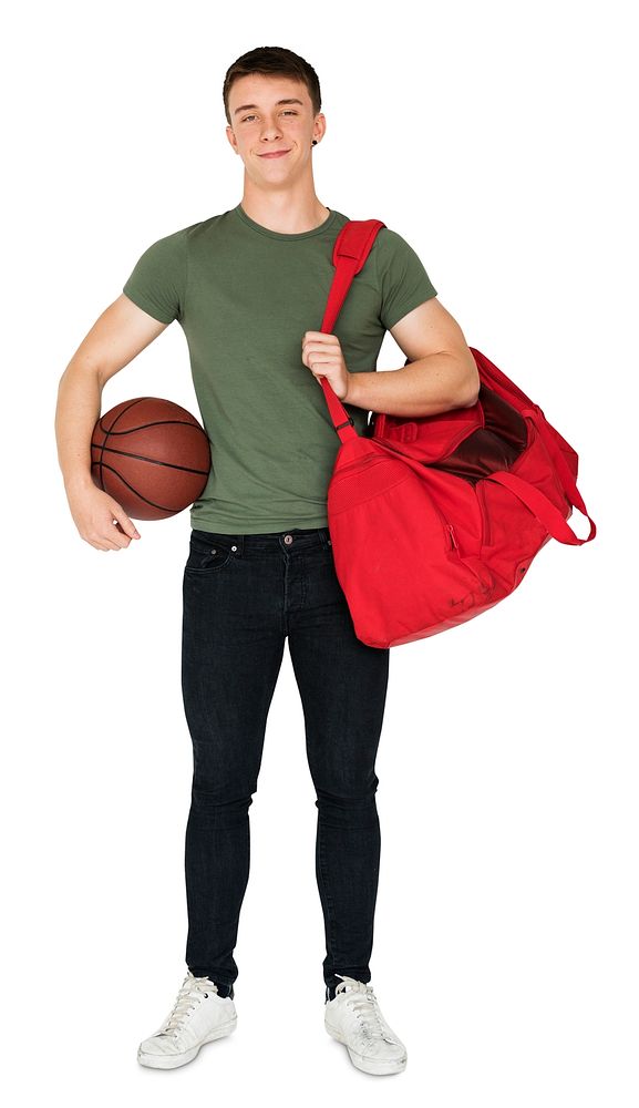 Young adult muscular man holding basketball