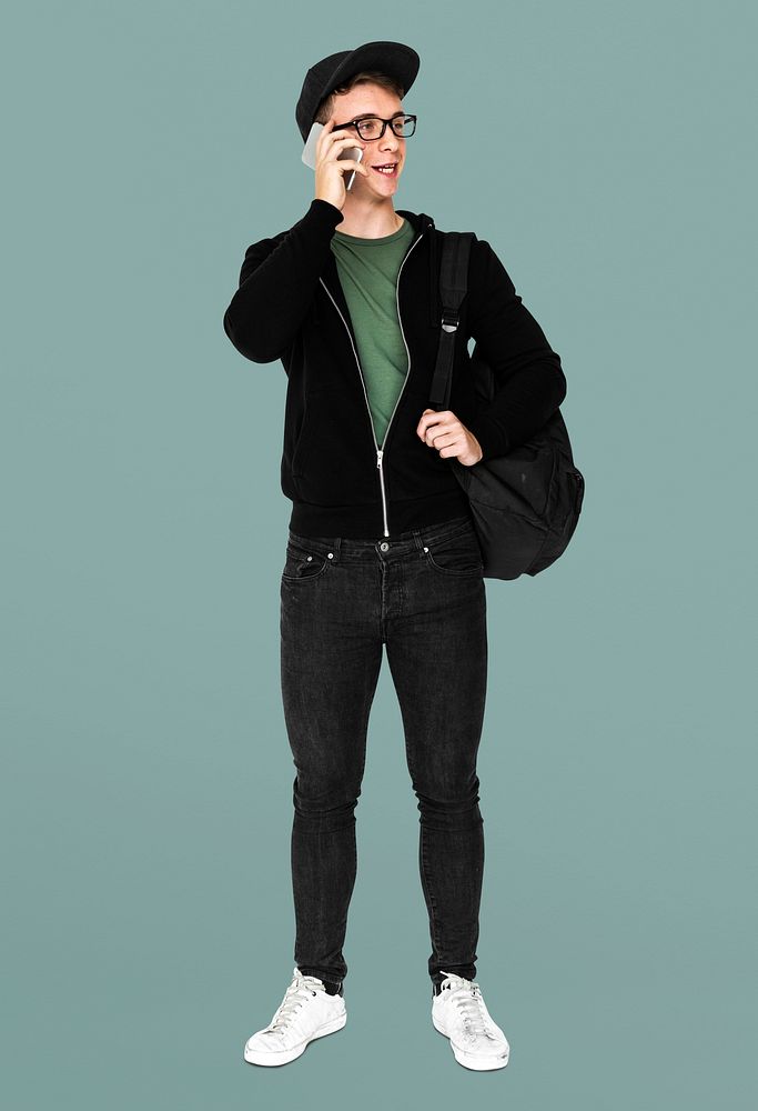 Young man with casual outfit talking phone standing