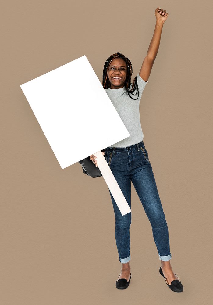 African girl arms raised and holding blank banner