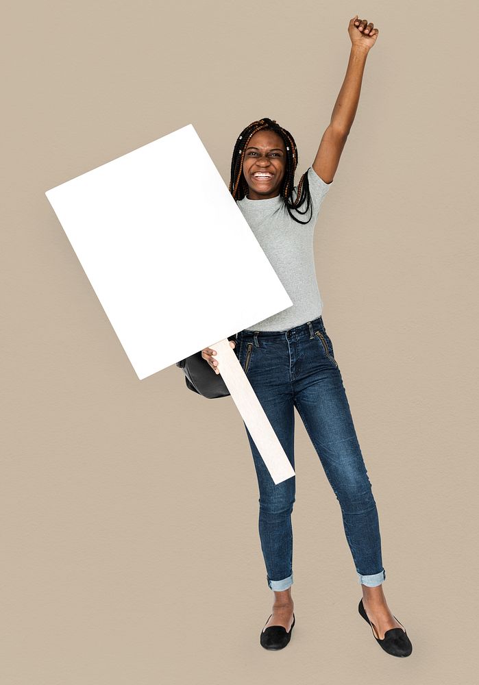 African girl arms raised and holding blank banner