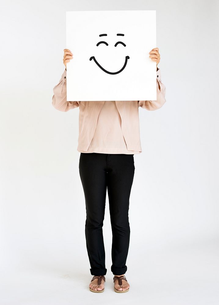 Woman holding smiling banner cover her face