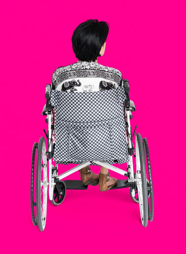 Disable Adult Woman Sitting on Wheelchair Studio Portrait