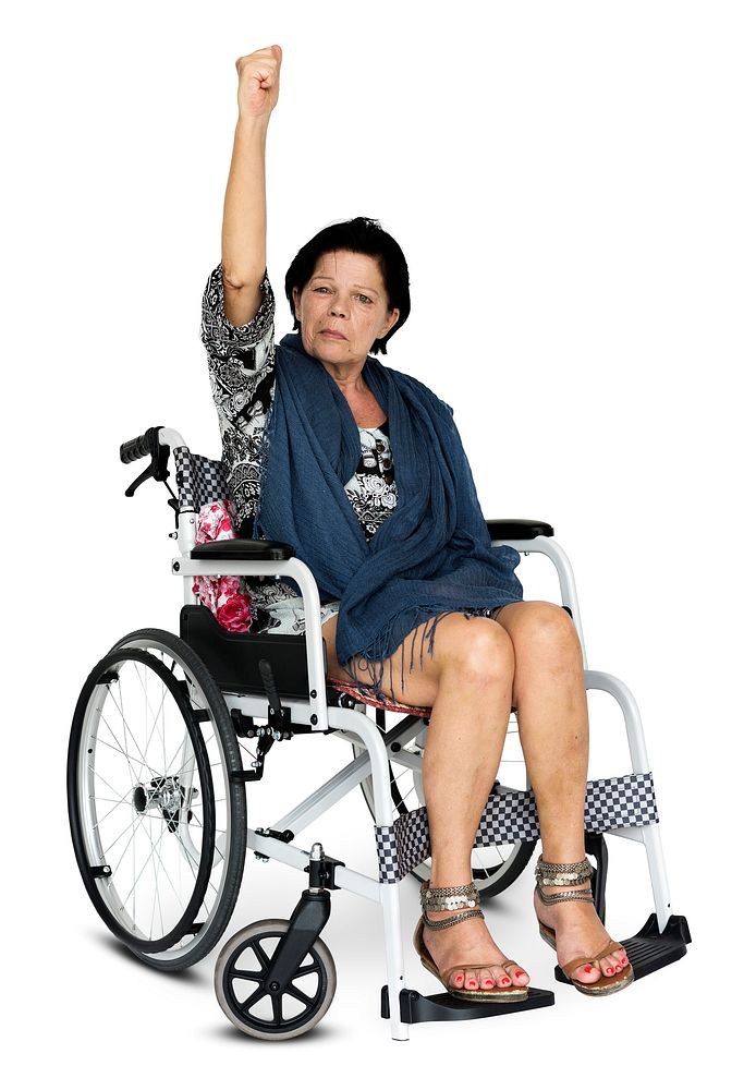 Woman sitting on wheelchair photoshooting in studio
