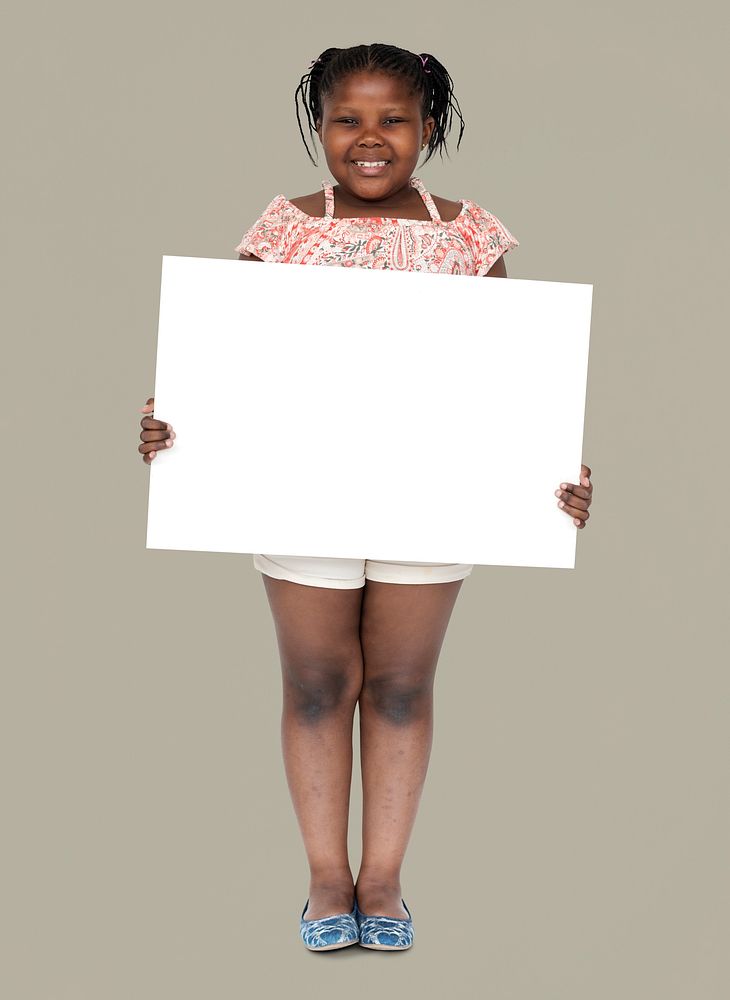Little african girl holding blank banner