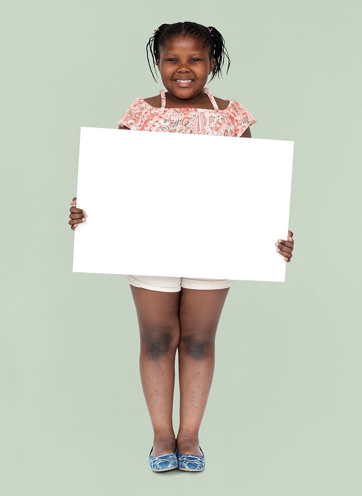 Little african girl holding blank banner
