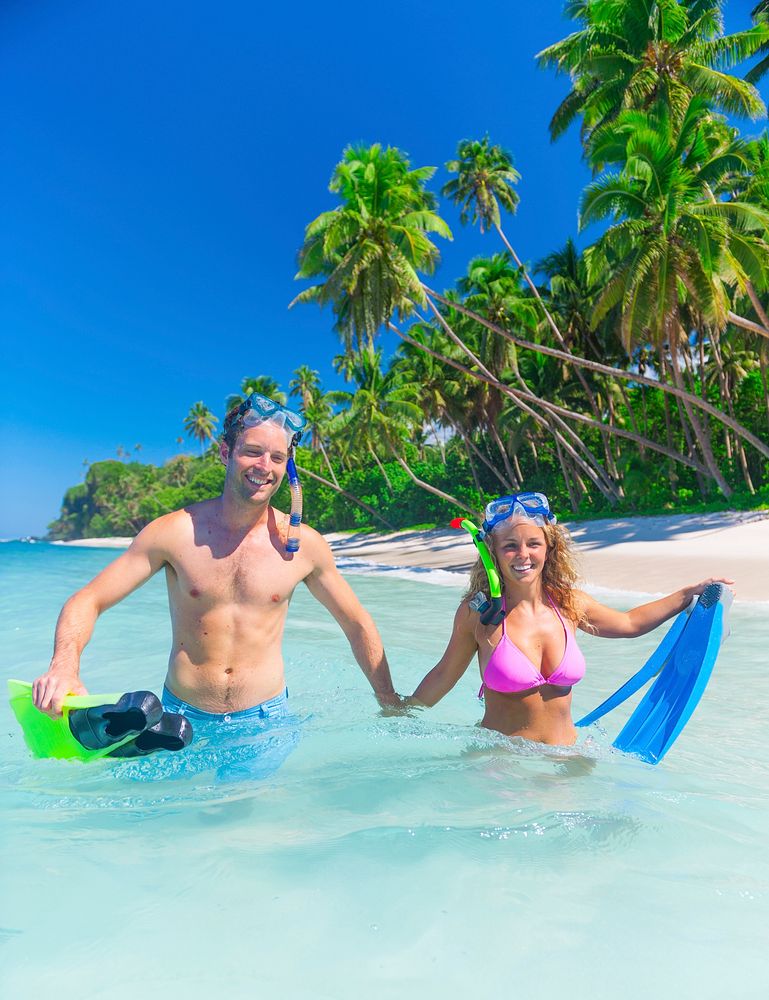 Couple snorkeling by the shore