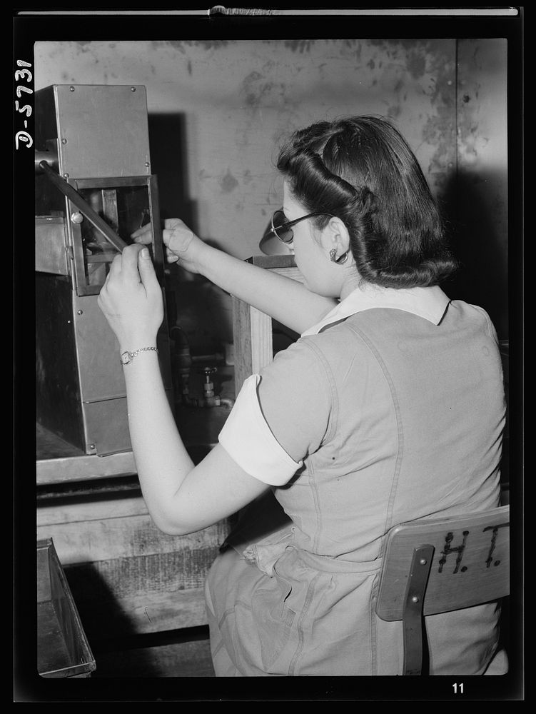 Women in industry. Tool  production. Testing small diameter, high-speed twist drills, this young woman employed by a Midwest…