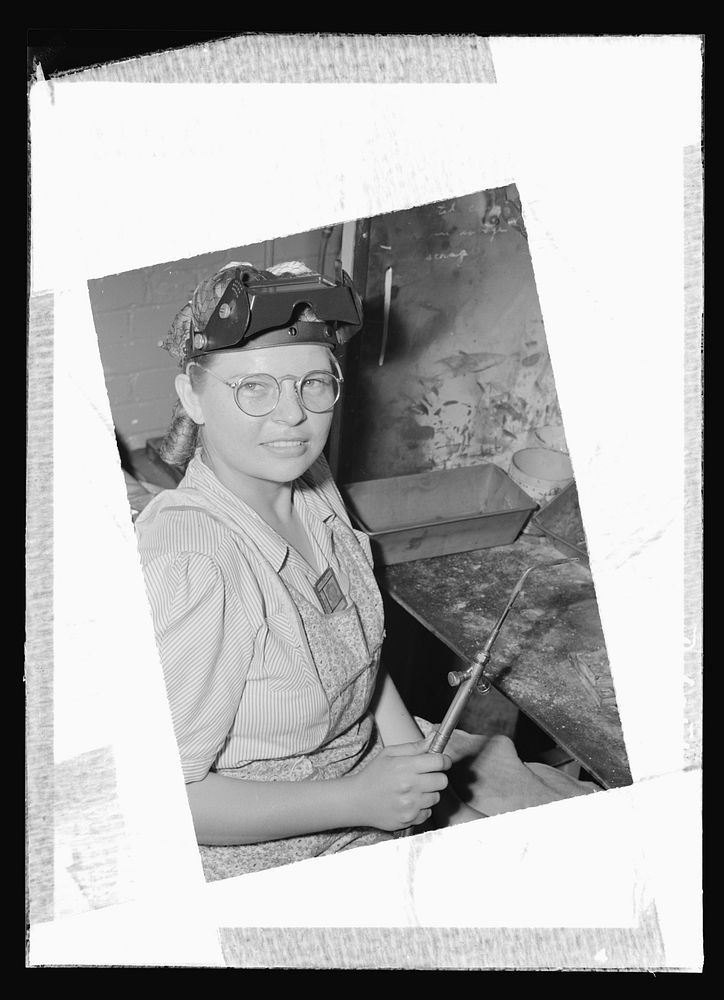 Women in war. Machine gun production operators. She carries a torch for the men of America's armed forces! Blonde, twenty…