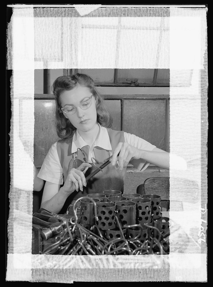 Women in war. Machine gun production. With swift, deft movements, this young worker, one of 2,000 women employed in a…