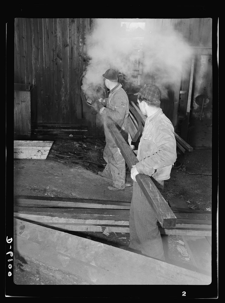 Production. Submarine chasers. Steaming a wooden section for a subchaser under construction at an Eastern boatyard. The…