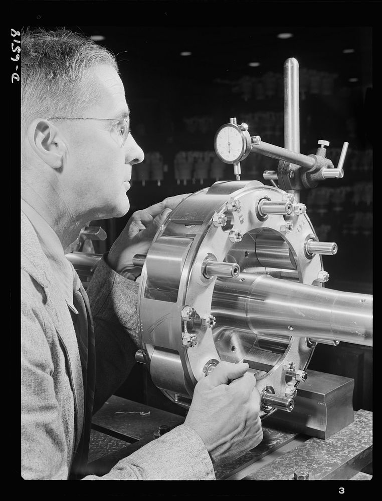 Production. Pratt and Whitney airplane engines. A propeller shaft of a Pratt and Whitney airplane engine is carefully…