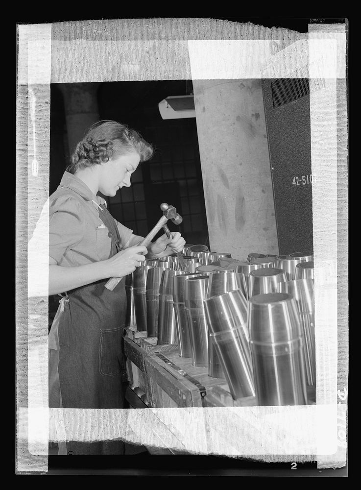 Production. 105 millimeter shells. One of the many women workers in a Midwest shell plant which formerly made plumbing…