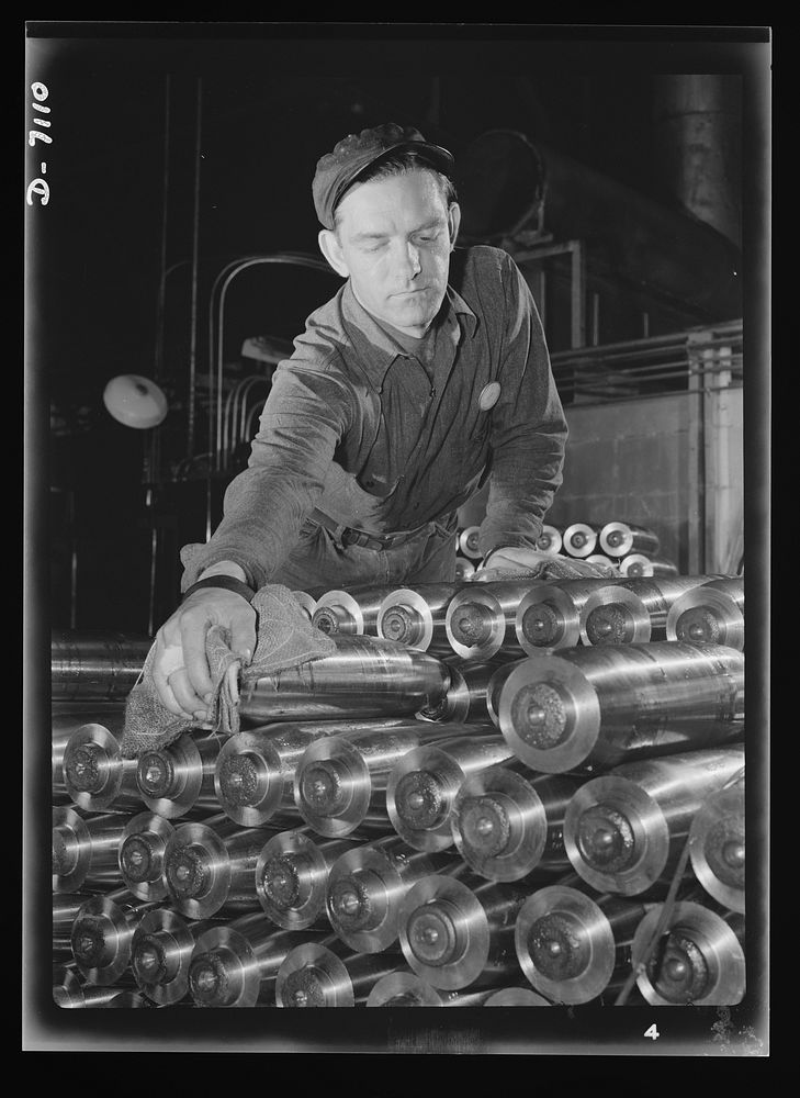 Production. 105 millimeter shells. Carefully stacked prior to shipment, thousands of shining shells await shipment to the…