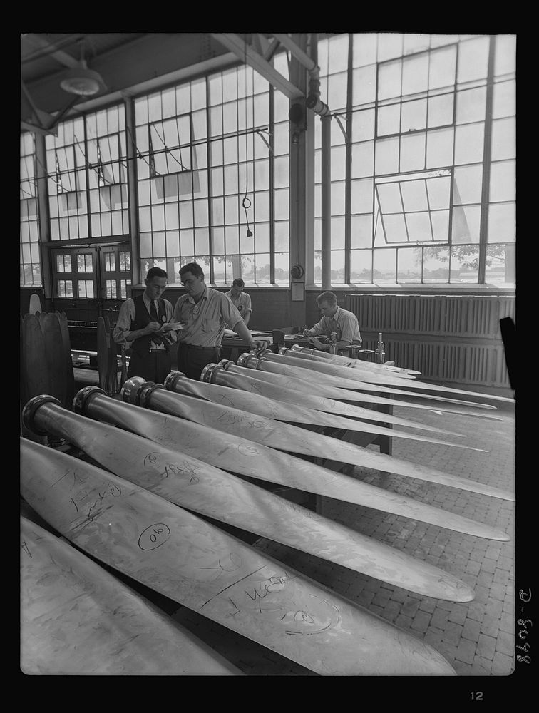 Production. Airplane propellers. Inspection of propeller blade finishes at Hartford, Connecticut, plant. The inspection…