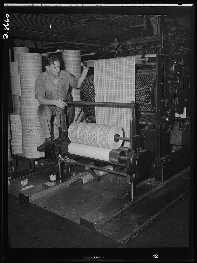 Printing war ration book 2. Printing coupons for war ration book 2. Pressman Adolph Beyer watches as the coupons roll from…