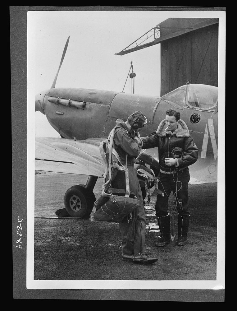 Reciprocal aid. Wearing British flying kits, Lieutenant E.D. Schofield of Belleville, Ohio and Lieutenant R.F. Sargent, of…
