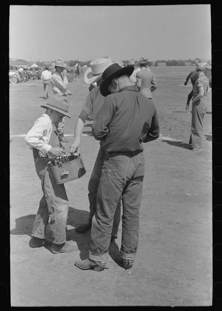 Cowboy buying a Coca-Cola, polo match, Abilene, Texas by Russell Lee