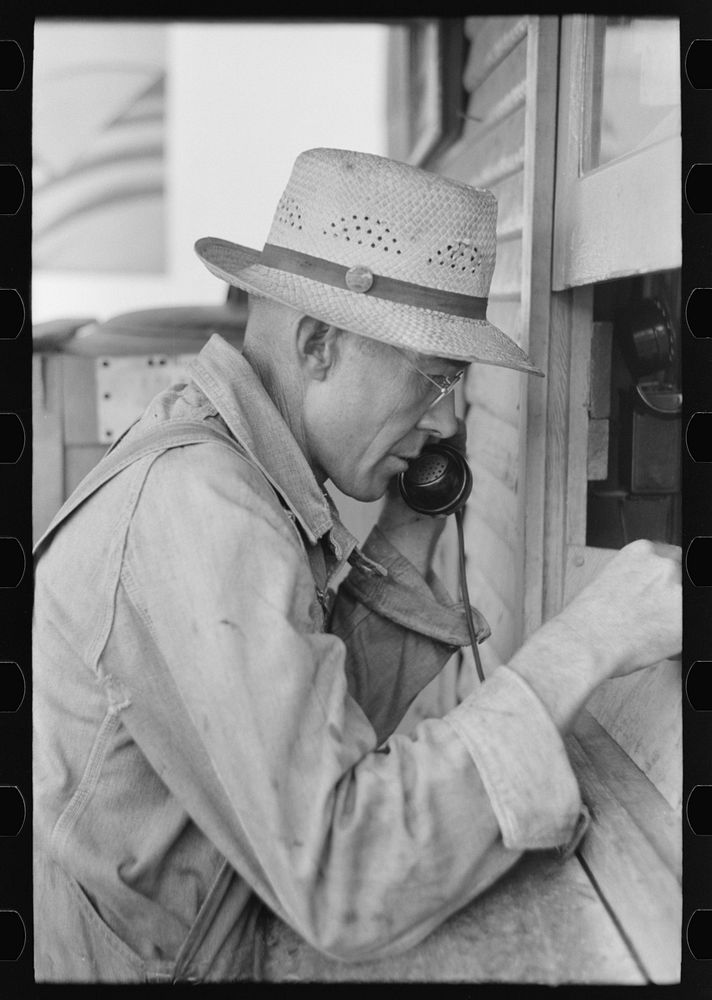 Streetcar employee reporting over telephone. Streetcar terminal, Oklahoma City, Oklahoma by Russell Lee