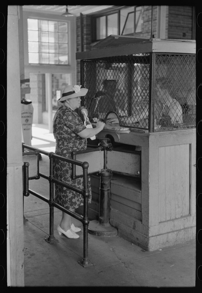 Woman buying ticket at gate. Streetcar terminal, Oklahoma City, Oklahoma by Russell Lee
