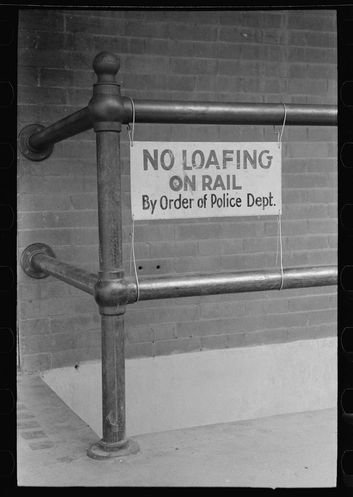 Sign on rail, Las Cruces, New Mexico by Russell Lee
