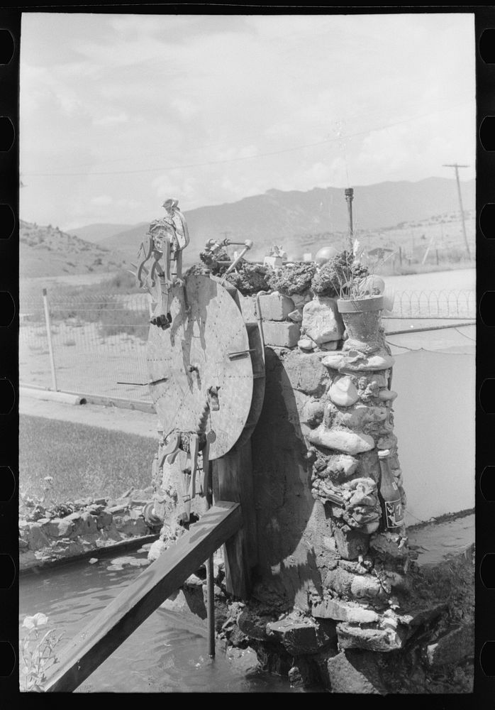 [Untitled photo, possibly related to: Fountain and goldfish tank in garden of Italian merchant in Cimarron, New Mexico] by…
