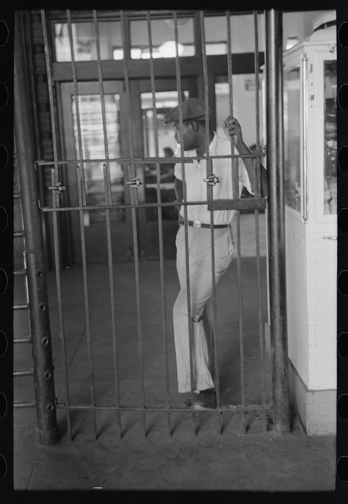 [Untitled photo, possibly related to:  waiting behind barricade at streetcar terminal, Oklahoma City, Oklahoma] by Russell…