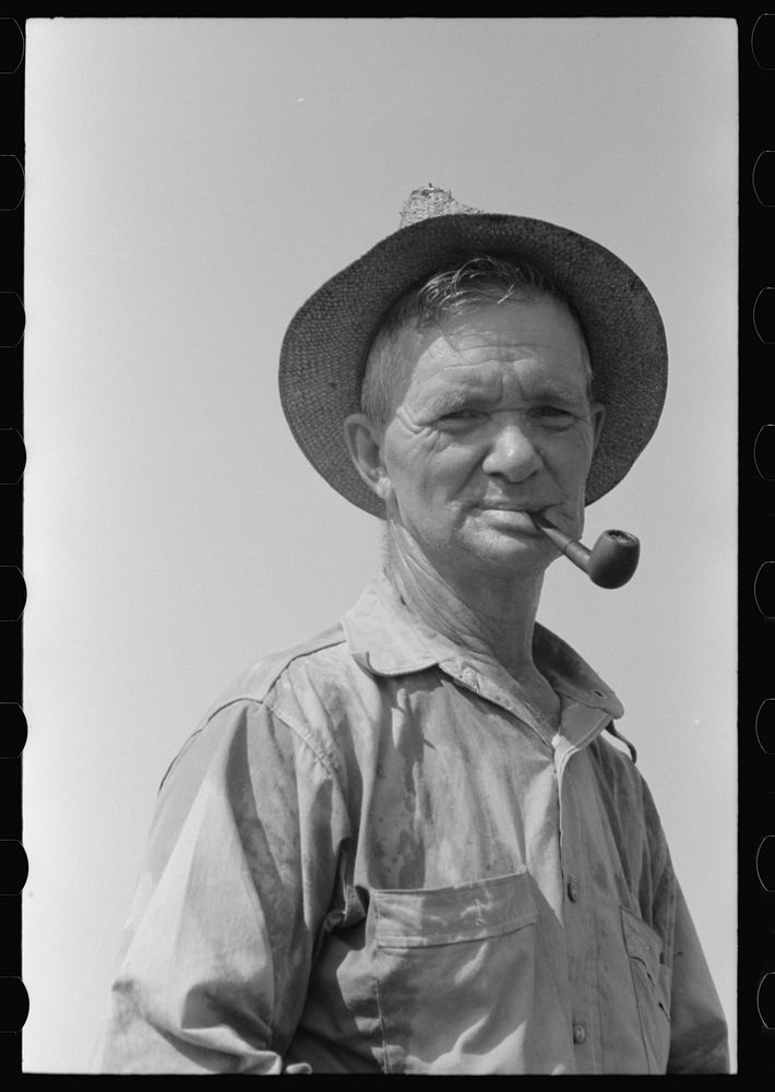 [Untitled photo, possibly related to: Veteran oil worker now in a ditch-digging gang. He has done everything in oil fields…