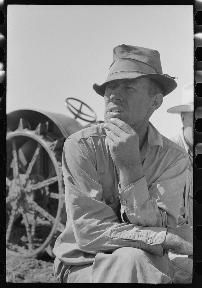 One of the Davidson brothers who own a cooperative well made possible by FSA (Farm Security Administration) loan, Gray…
