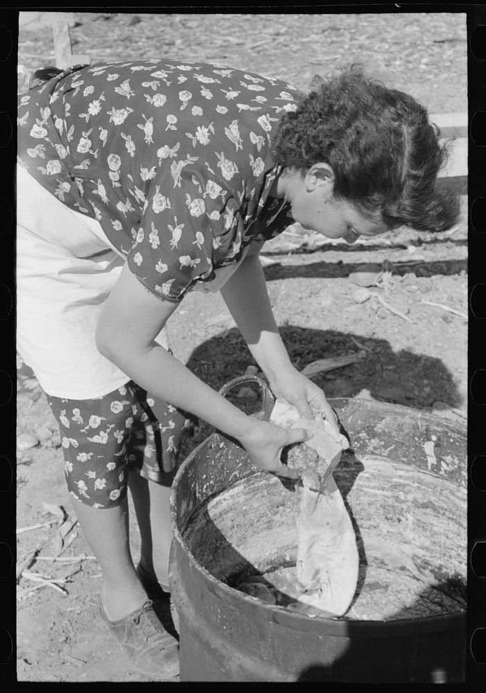 Spanish-American FSA (Farm Security Administration) client wiping homemade soap to remove surface dirt, Taos County, New…