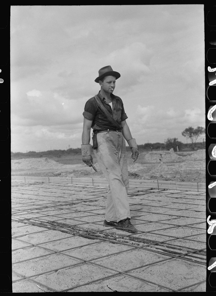 [Untitled photo, possibly related to: Fitting water pipe at migrant camp under construction at Sinton, Texas] by Russell Lee