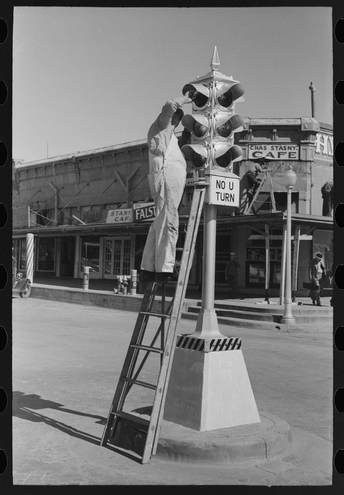 Painting traffic lights, Taylor, Texas by Russell Lee