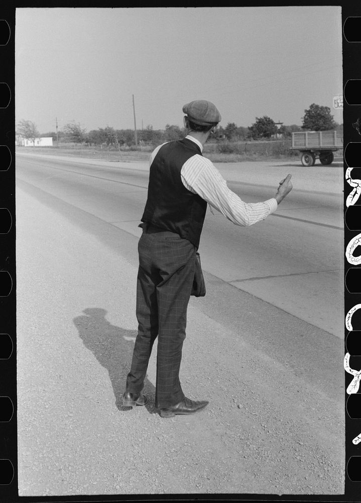 [Untitled photo, possibly related to: Hitchhiker at city limits of Waco, Texas] by Russell Lee