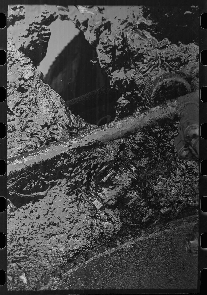 [Untitled photo, possibly related to: Waste oil at storage tanks, Creek County, Oklahoma] by Russell Lee