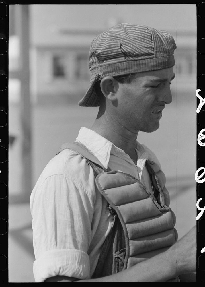 [Untitled photo, possibly related to: Migratory laborers like to play baseball. Here is one of them in a catchers uniform at…