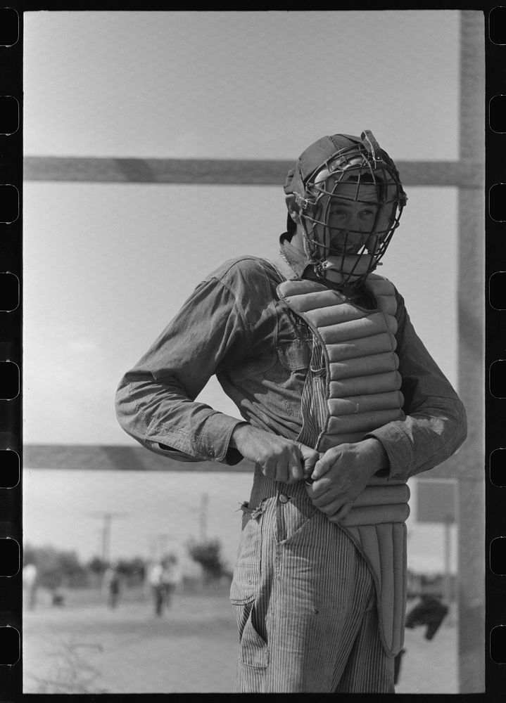 Migratory laborers like to play baseball. Here is one of them in a catchers uniform, at the Agua Fria Migratory Labor Camp…