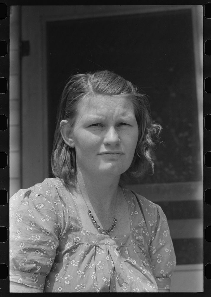 Daughter of a migratory laborer living at the Agua Fria Migratory Labor Camp, Arizona by Russell Lee