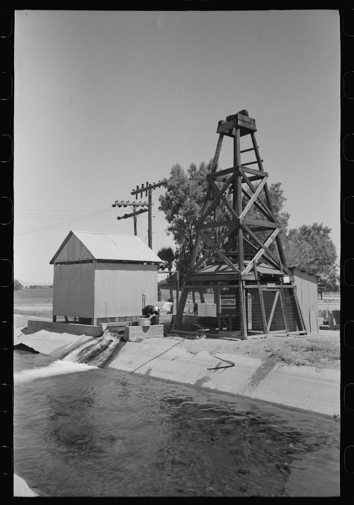 Deep well and pump house at side of irrigation ditch, Maricopa County, Arizona by Russell Lee
