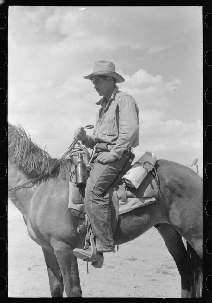 [Untitled photo, possibly related to: Cowboy with Spanish cowpony. Pie Town, New Mexico] by Russell Lee