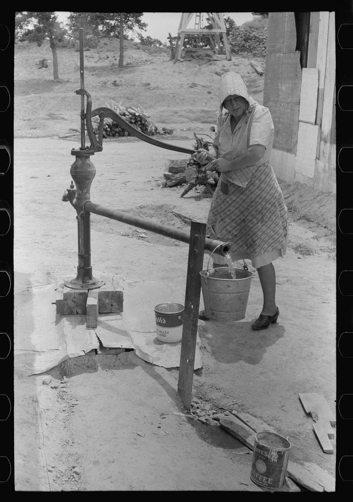 Pumping water, Pie Town, New Mexico by Russell Lee