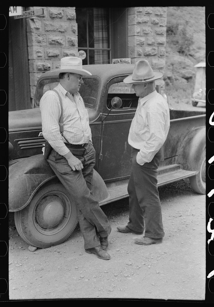 [Untitled photo, possibly related to: Deputy sheriff and constable talking, Mogollon, New Mexico] by Russell Lee