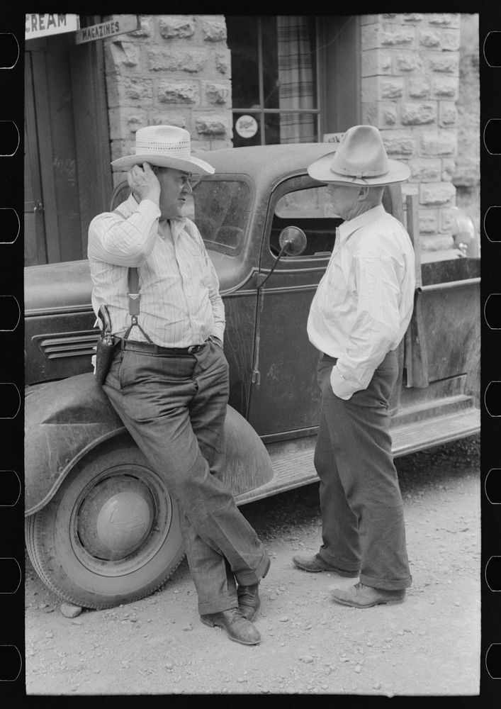 Deputy sheriff and constable talking, Mogollon, New Mexico by Russell Lee