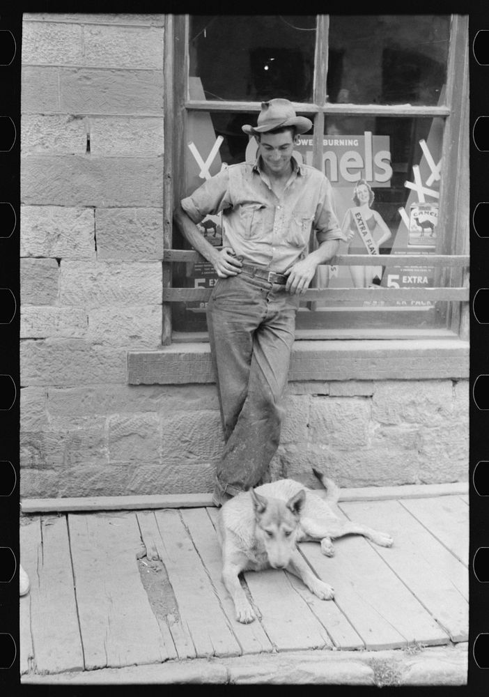 Gold miner with his dog, Mogollon, New Mexico by Russell Lee