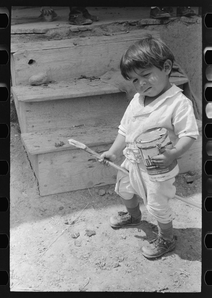 [Untitled photo, possibly related to: Spanish-American boy playing horse, Chamisal, New Mexico] by Russell Lee