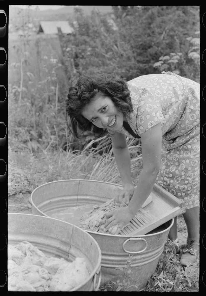 Spanish-American girl washing wool, Chamisal, New Mexico by Russell Lee