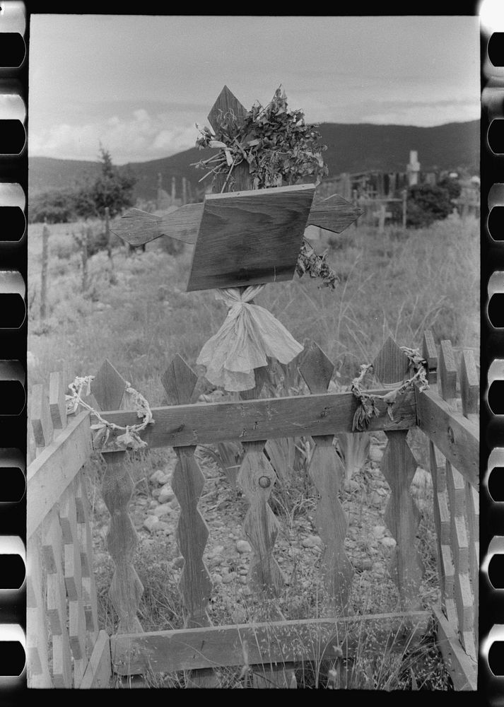 Decoration of grave in Spanish-American cemetery, Penasco, New Mexico by Russell Lee