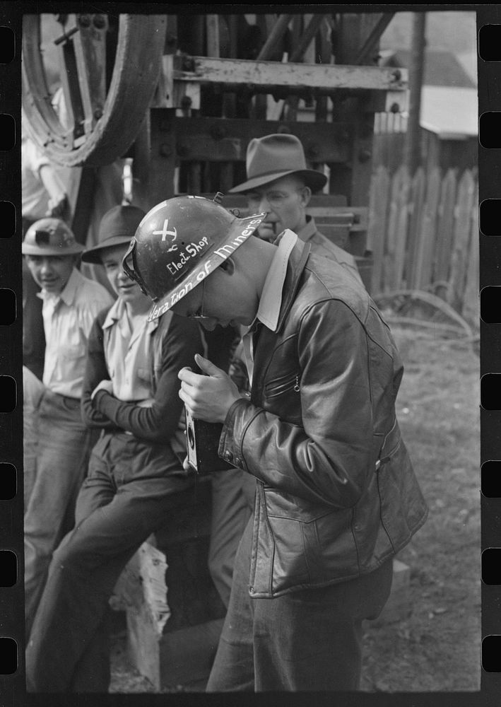 Young miners taking pictures at Labor Day celebration, Silverton, Colorado by Russell Lee