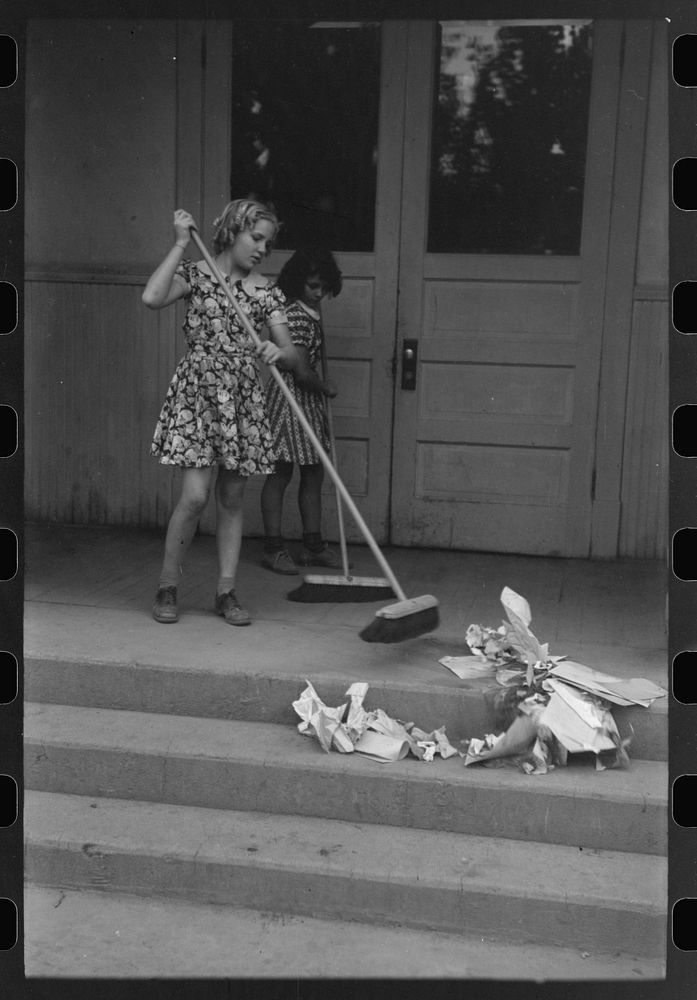 [Untitled photo, possibly related to: Schoolchildren cleaning up schoolroom. The janitors fee thus saved is given by the…