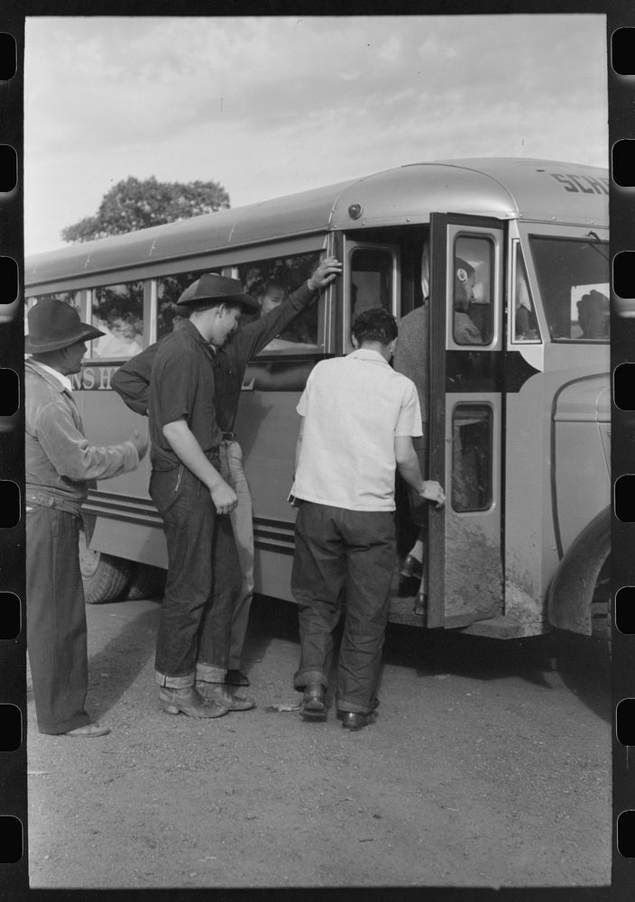 Schoolchildren of Concho, Arizona boarding the bus to go to the high school at St. Johns, Arizona by Russell Lee