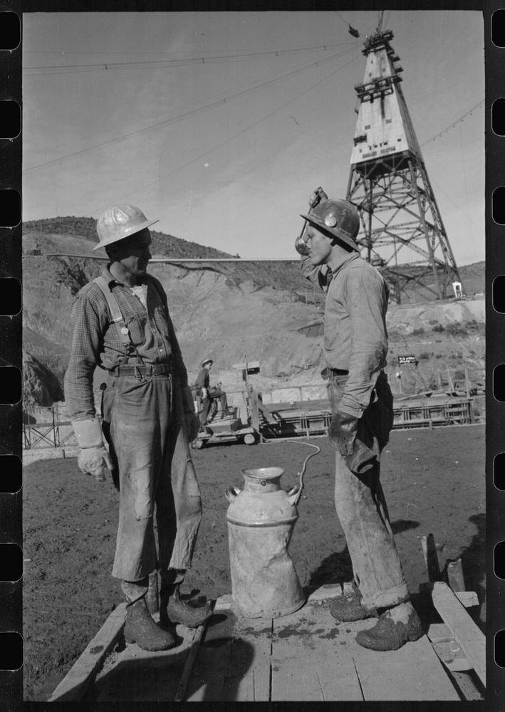[Untitled photo, possibly related to: Construction workers getting a drink of water. Main distributing tower is in the rear.…